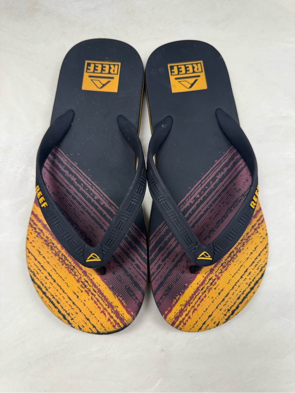 Reef Men’s Navy Maroon and Yellow Graphic Flip Flops